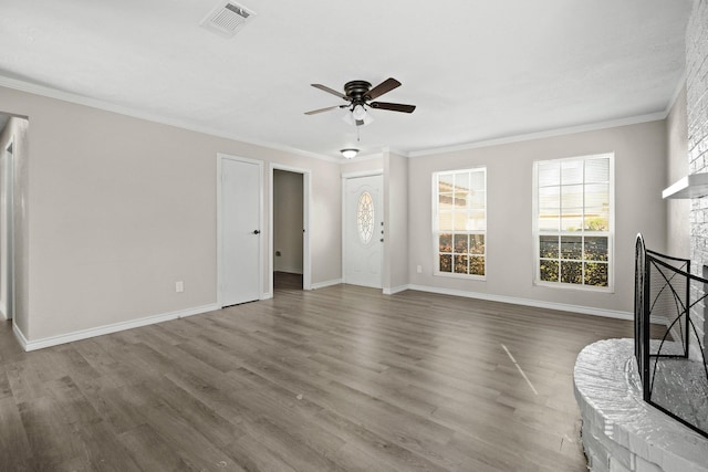 unfurnished living room featuring ceiling fan, a fireplace, ornamental molding, and hardwood / wood-style flooring