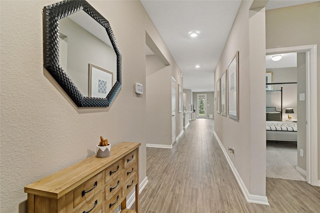 corridor featuring light wood-type flooring