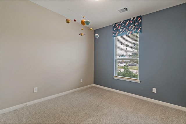 unfurnished room with carpet floors and a healthy amount of sunlight