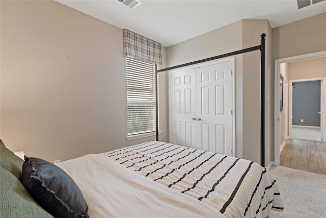 carpeted bedroom featuring a closet