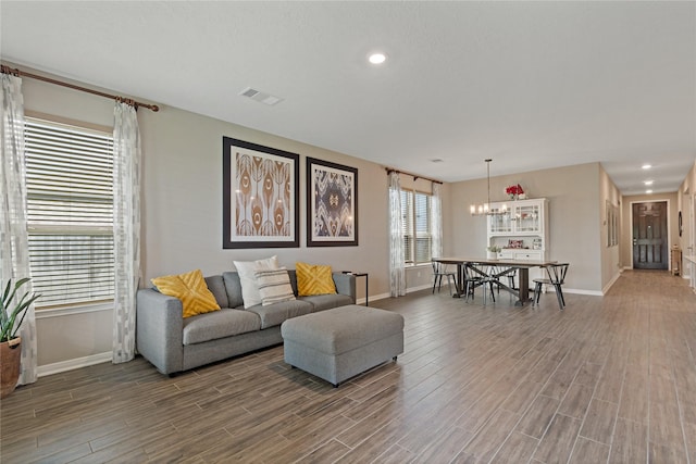 living room featuring an inviting chandelier