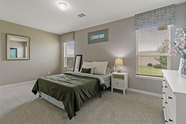 bedroom featuring light colored carpet