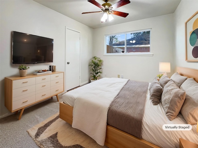 bedroom featuring ceiling fan and light colored carpet