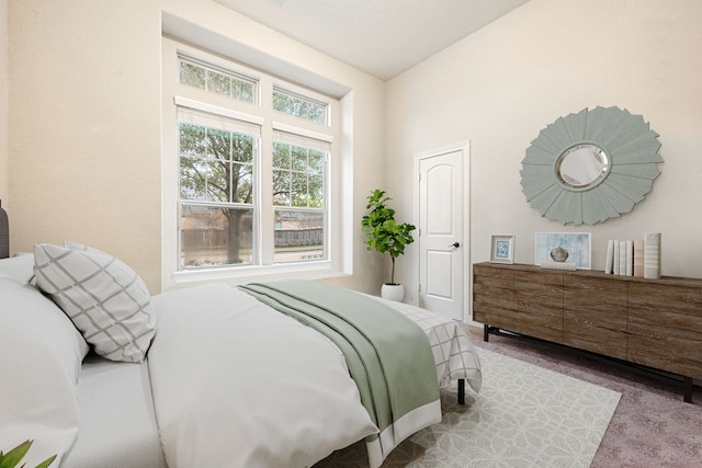 carpeted bedroom with vaulted ceiling