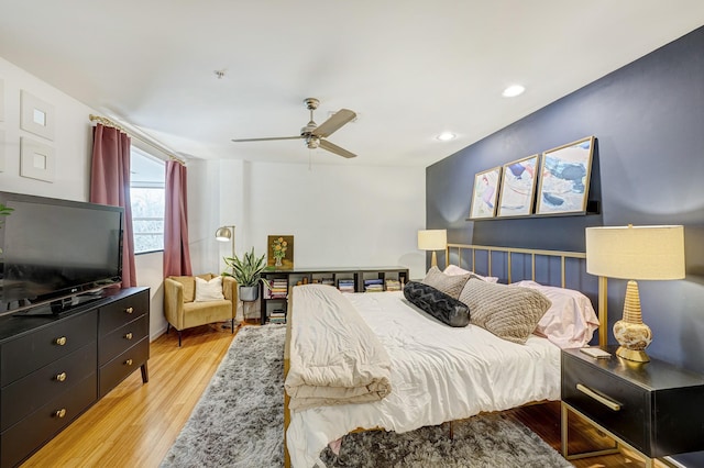 bedroom featuring ceiling fan and light hardwood / wood-style floors