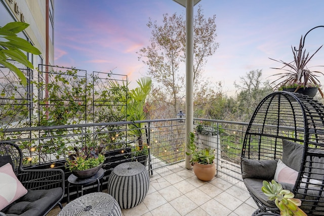 view of balcony at dusk