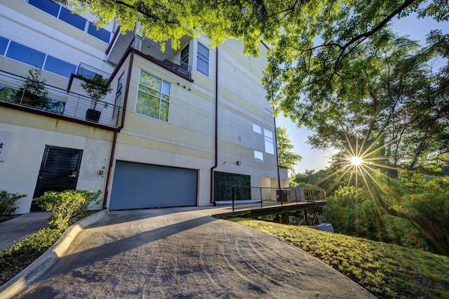 view of side of home featuring a garage