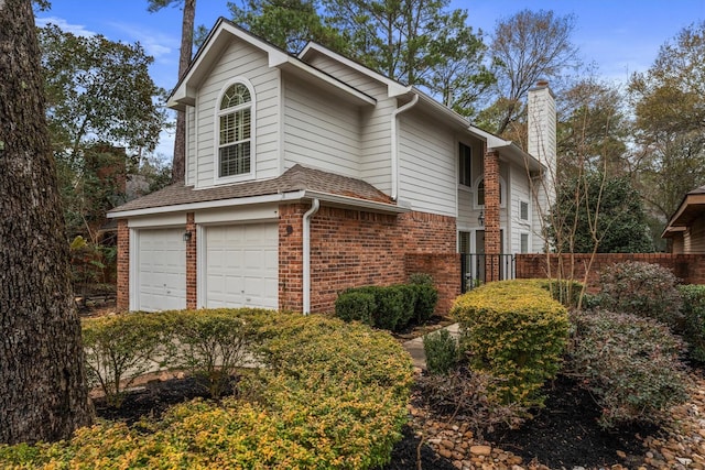 view of side of property featuring a garage