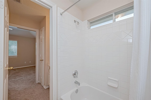 bathroom featuring shower / bathtub combination with curtain