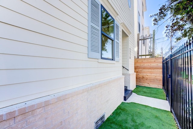 view of side of property with a yard