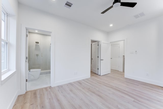 unfurnished bedroom with light hardwood / wood-style flooring, ceiling fan, and ensuite bathroom