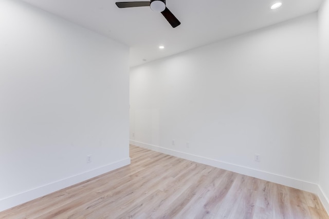 spare room with light hardwood / wood-style flooring and ceiling fan