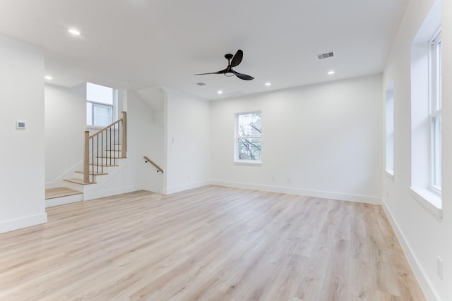 spare room featuring ceiling fan and light wood-type flooring