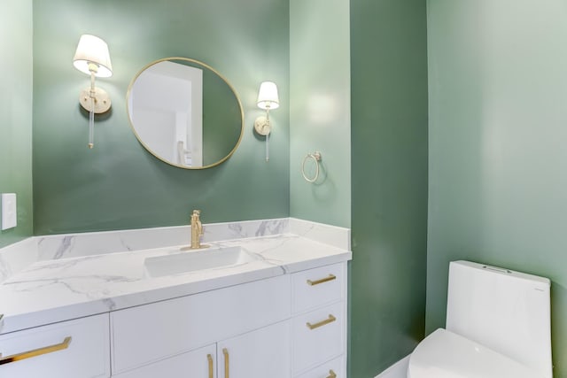 bathroom with vanity and toilet