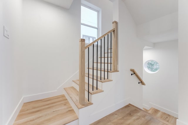 staircase featuring hardwood / wood-style floors