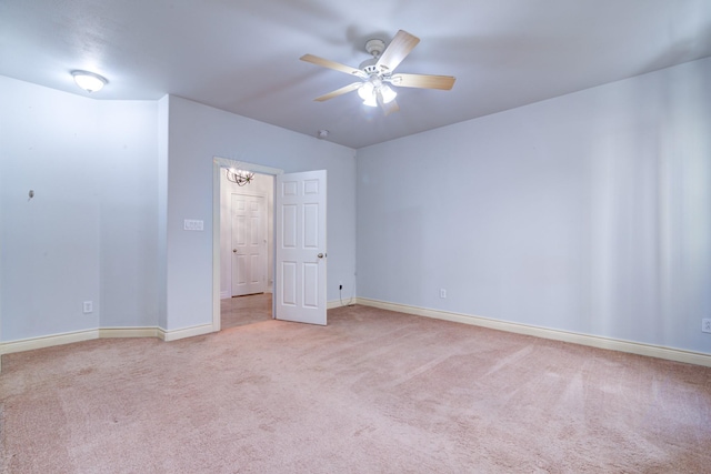 unfurnished bedroom featuring light carpet and ceiling fan