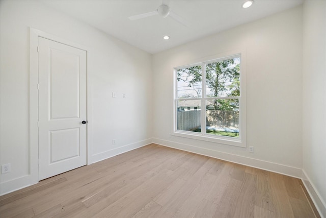 unfurnished room featuring light wood-type flooring and ceiling fan