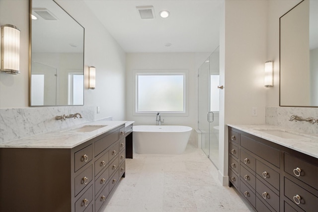 bathroom with separate shower and tub and vanity