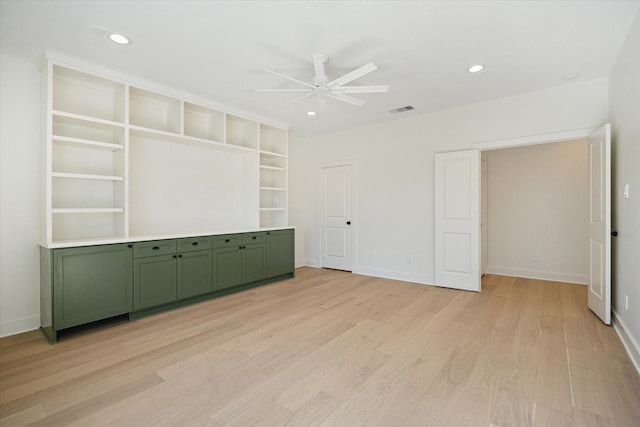 unfurnished bedroom featuring light wood-type flooring and ceiling fan