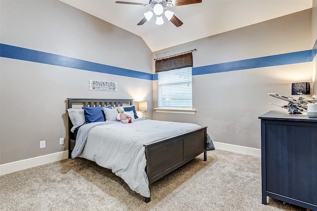 carpeted bedroom featuring ceiling fan and vaulted ceiling