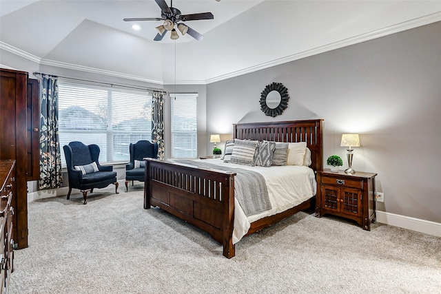 carpeted bedroom with ceiling fan, a tray ceiling, crown molding, and lofted ceiling