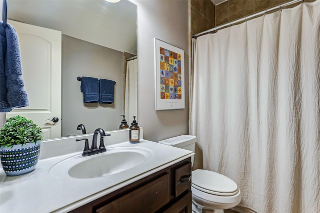 bathroom with toilet and vanity