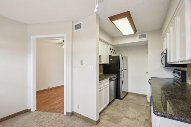 kitchen with ceiling fan, white cabinets, and appliances with stainless steel finishes