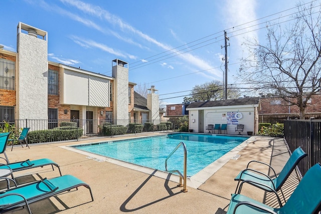 view of swimming pool featuring a patio