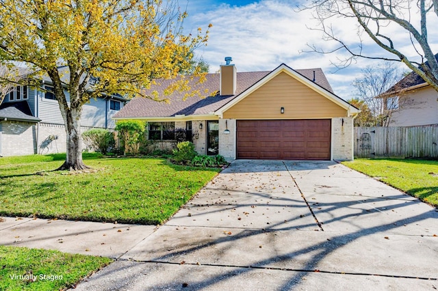 view of front of house with a front lawn and a garage