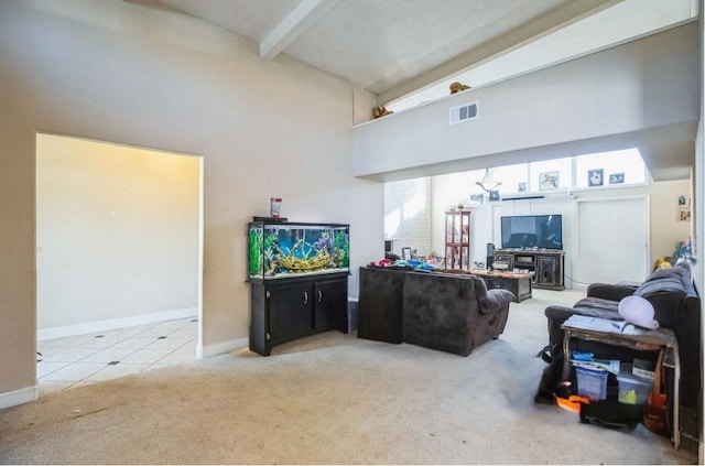 carpeted living room featuring a high ceiling and beamed ceiling