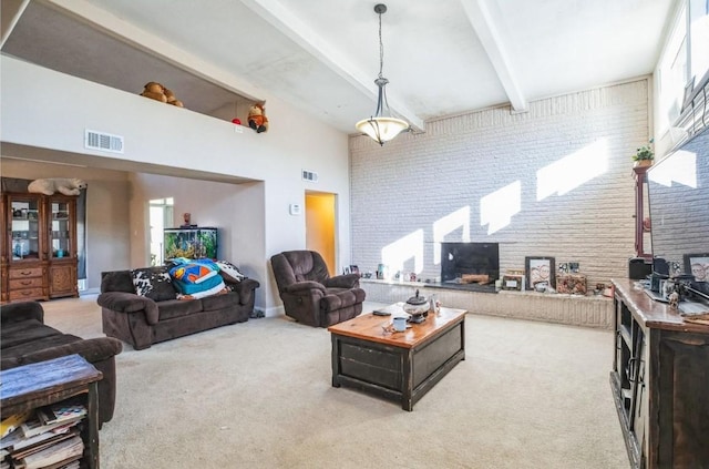 carpeted living room with brick wall, beam ceiling, and a high ceiling