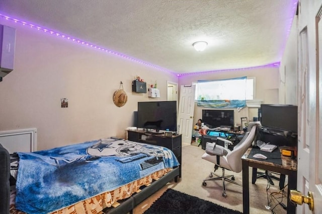 carpeted bedroom with a textured ceiling