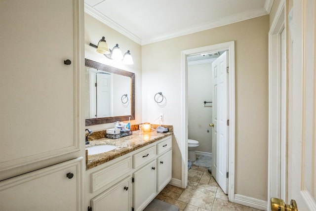 bathroom with toilet, ornamental molding, and vanity