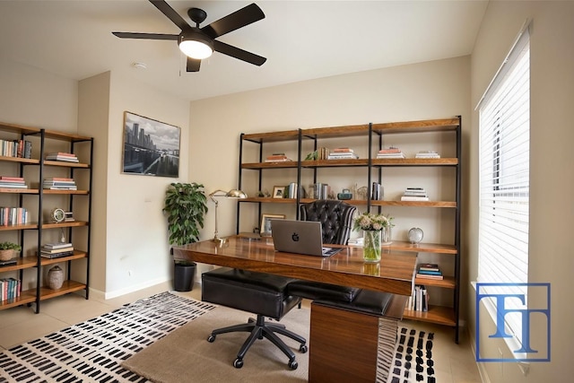 office with ceiling fan and light tile patterned flooring