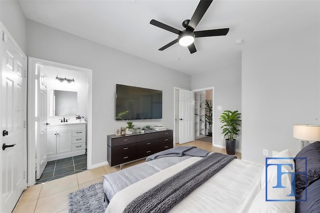 bedroom featuring ensuite bath, sink, ceiling fan, and light tile patterned flooring