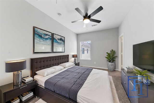 bedroom featuring ceiling fan and carpet