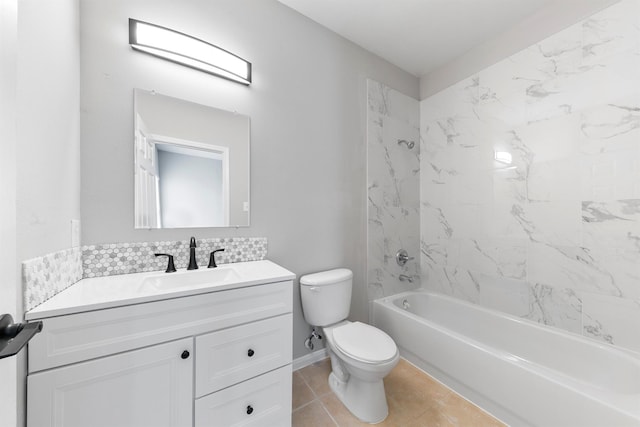 full bathroom with toilet, tile patterned flooring, tiled shower / bath, and vanity