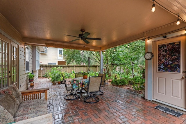 view of patio featuring ceiling fan