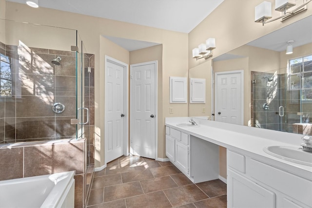 bathroom featuring vanity, shower with separate bathtub, and tile patterned flooring