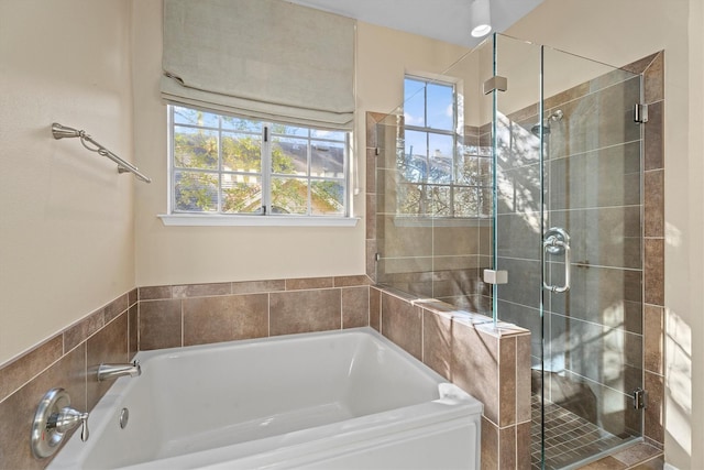 bathroom with plenty of natural light and plus walk in shower