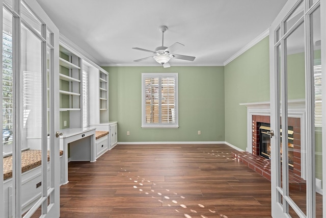 living room with a fireplace, ornamental molding, dark hardwood / wood-style floors, and ceiling fan