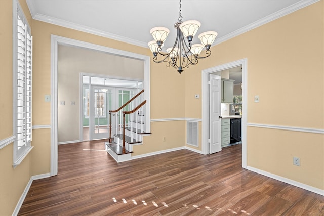 interior space featuring an inviting chandelier, crown molding, and dark hardwood / wood-style floors