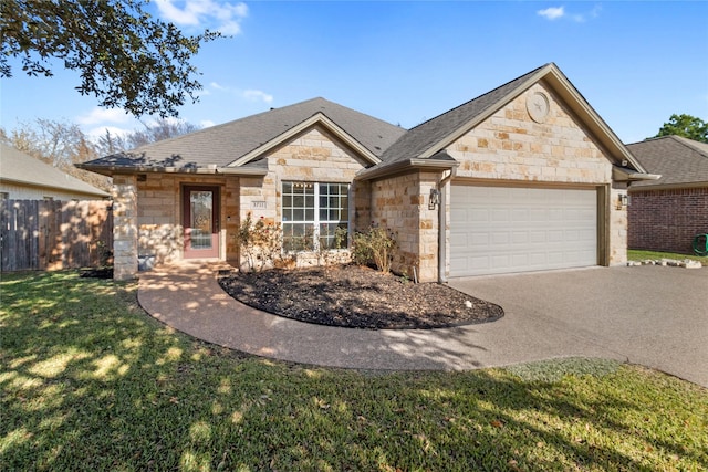 view of front of house featuring a front lawn and a garage