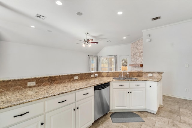 kitchen featuring white cabinetry, ceiling fan, stainless steel dishwasher, light stone counters, and sink