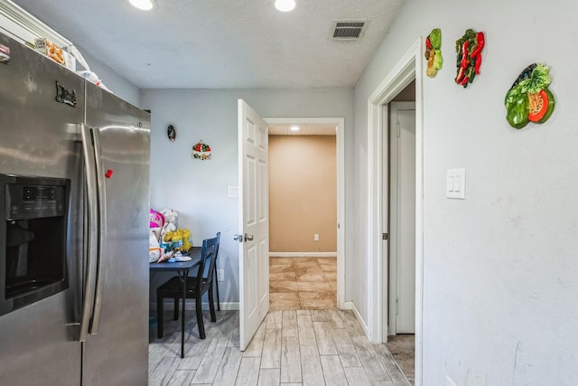 kitchen featuring stainless steel fridge