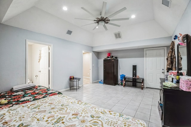 tiled bedroom with ceiling fan, lofted ceiling, and a tray ceiling