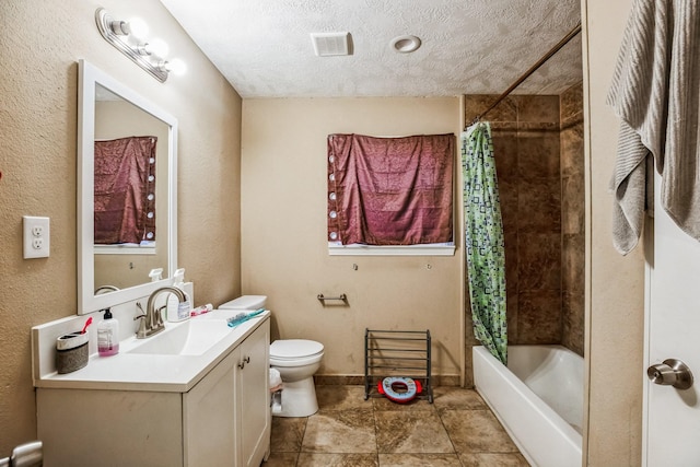 full bathroom with shower / bath combo with shower curtain, a textured ceiling, toilet, and vanity