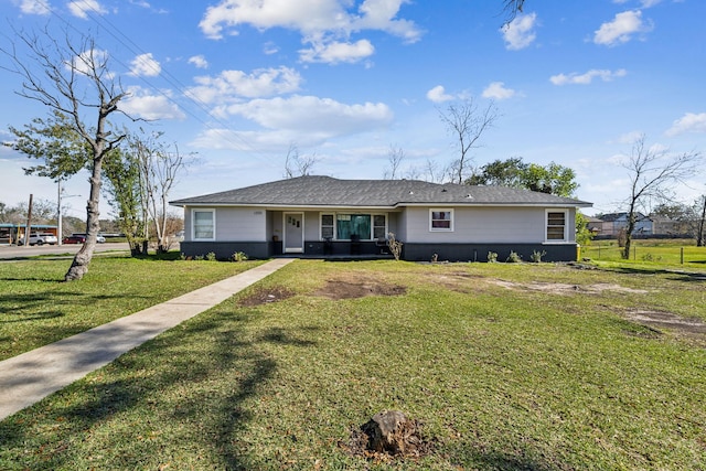 ranch-style home featuring a front lawn