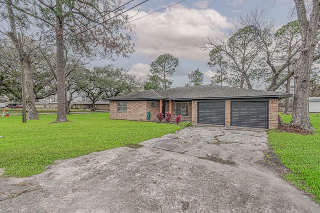 ranch-style home featuring a garage and a front yard