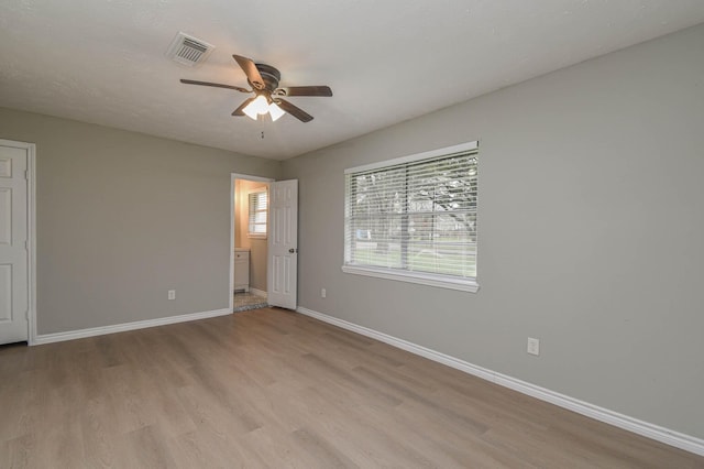 unfurnished bedroom featuring ceiling fan and light hardwood / wood-style floors